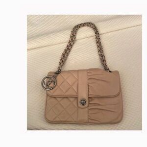 Authentic Chanel beige leather flap bag.